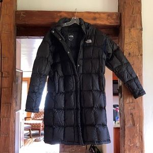 Women’s XL North face long down jacket.